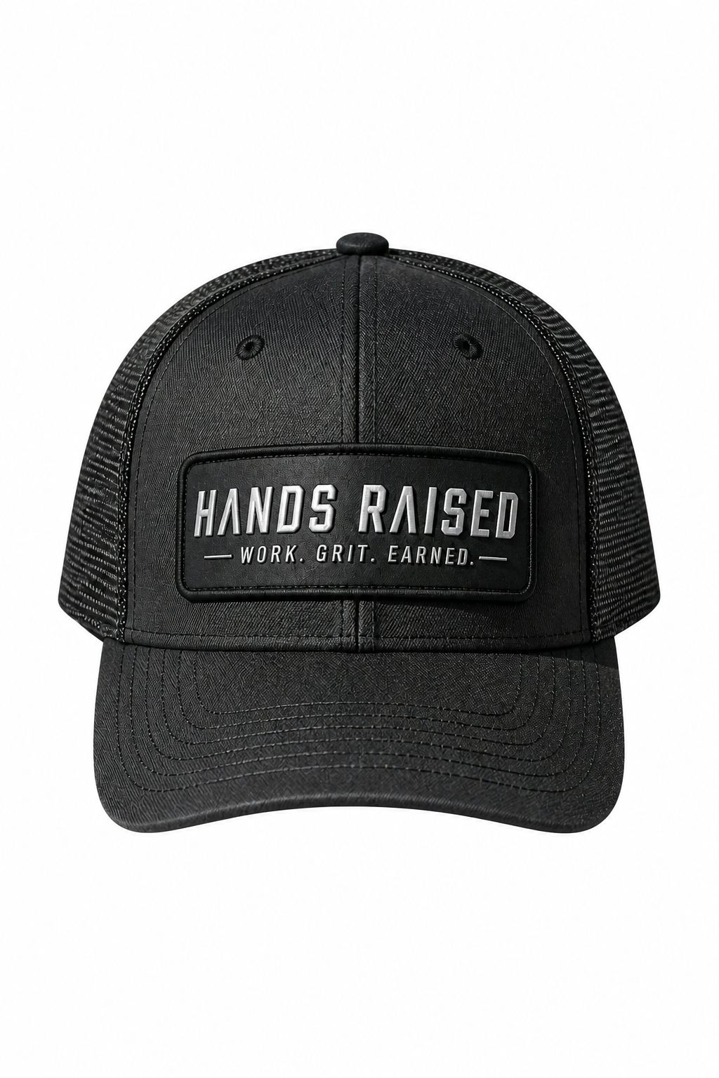 A black trucker hat with a black mesh back and a front patch reading 'HANDS RAISED' and 'WORK, GRIT, EARNED.' on a plain white background.